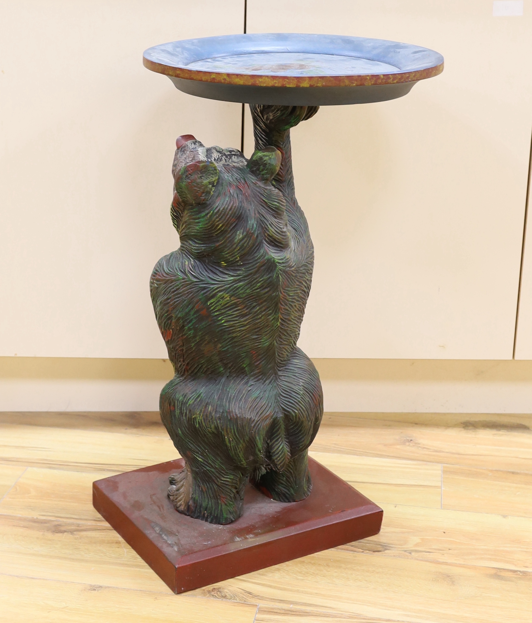 A carved and painted Black Forest bear dumb waiter, 72cm high